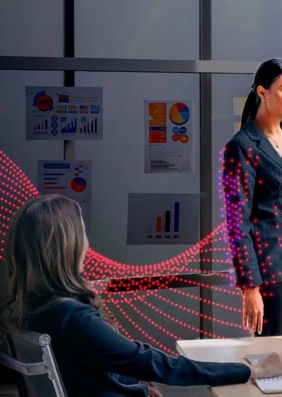 Group of people having a meeting, looking at a Sharp Audio Visual