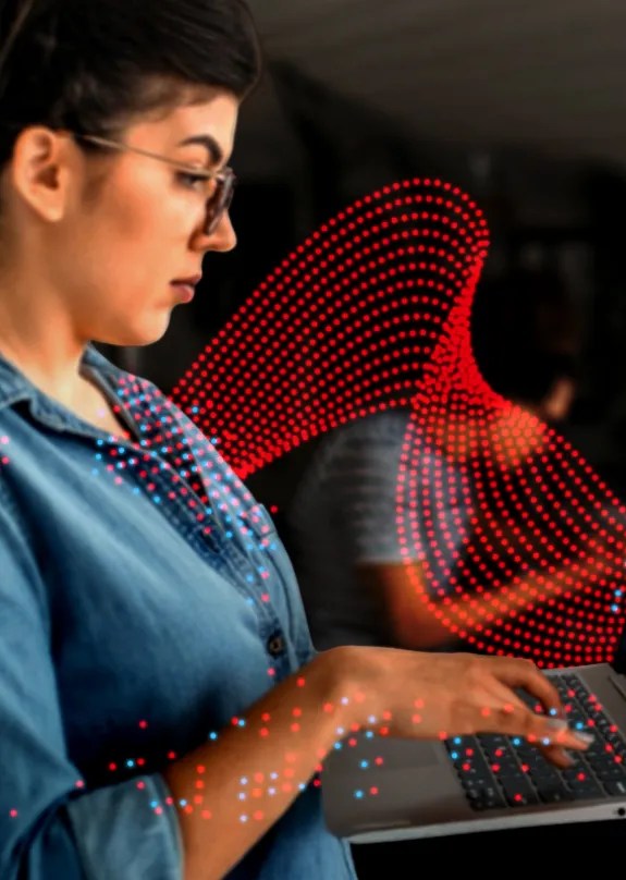 Woman typing on a laptop